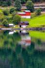 Norway, Norwegian Fjords. European village, red and brown barns. Art Print